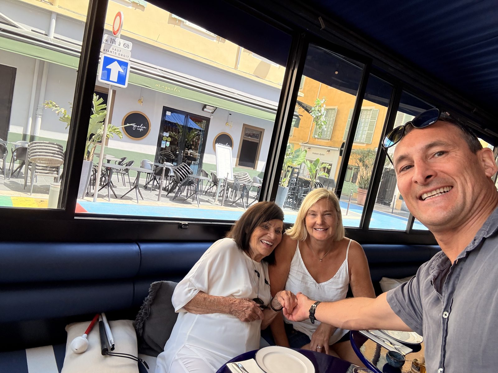 Four of the family around a restaurant banquette on the first afternoon