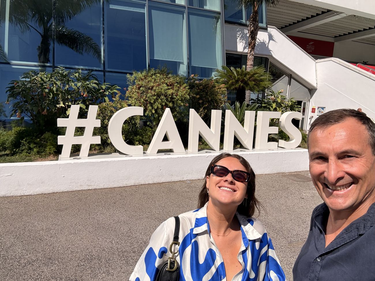 Two of the family beside the #CANNES sign on the Croisette