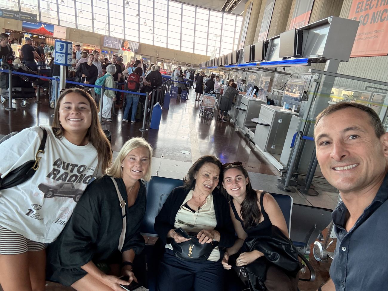 The family gathered in a busy departures hall early on Sunday morning