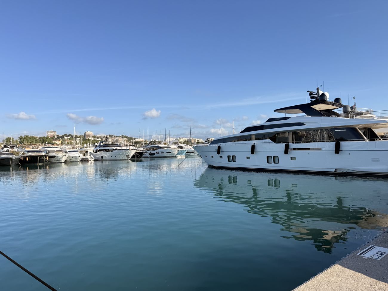 The port at Antibes early on a Sunday morning, yachts on flat calm water