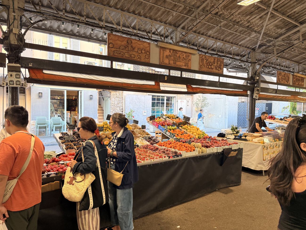 The covered Marché Provençal at Antibes, stalls and shoppers