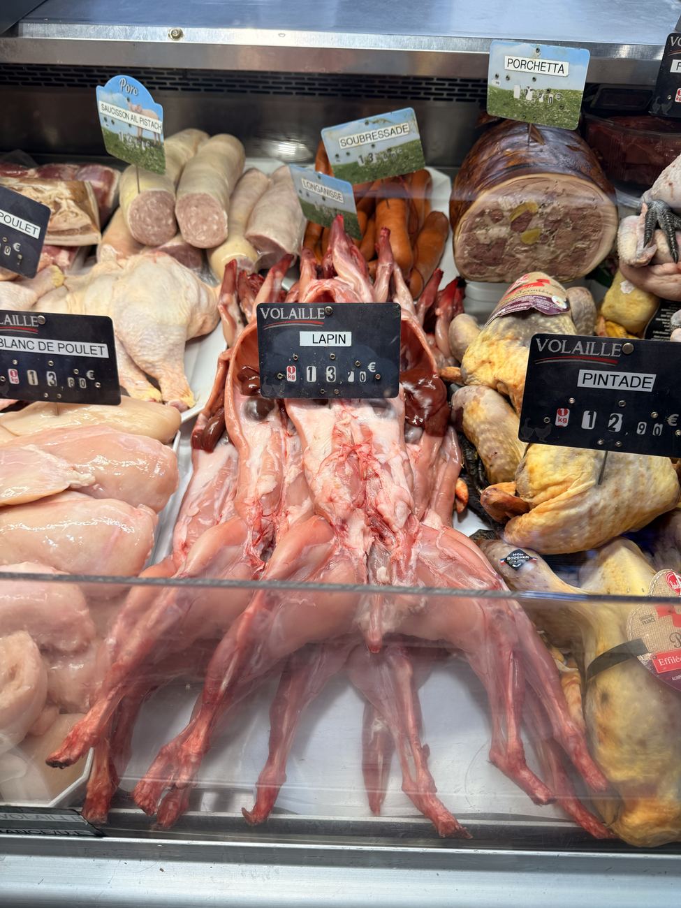 A fishmonger's display of langoustines and prawns banked on ice