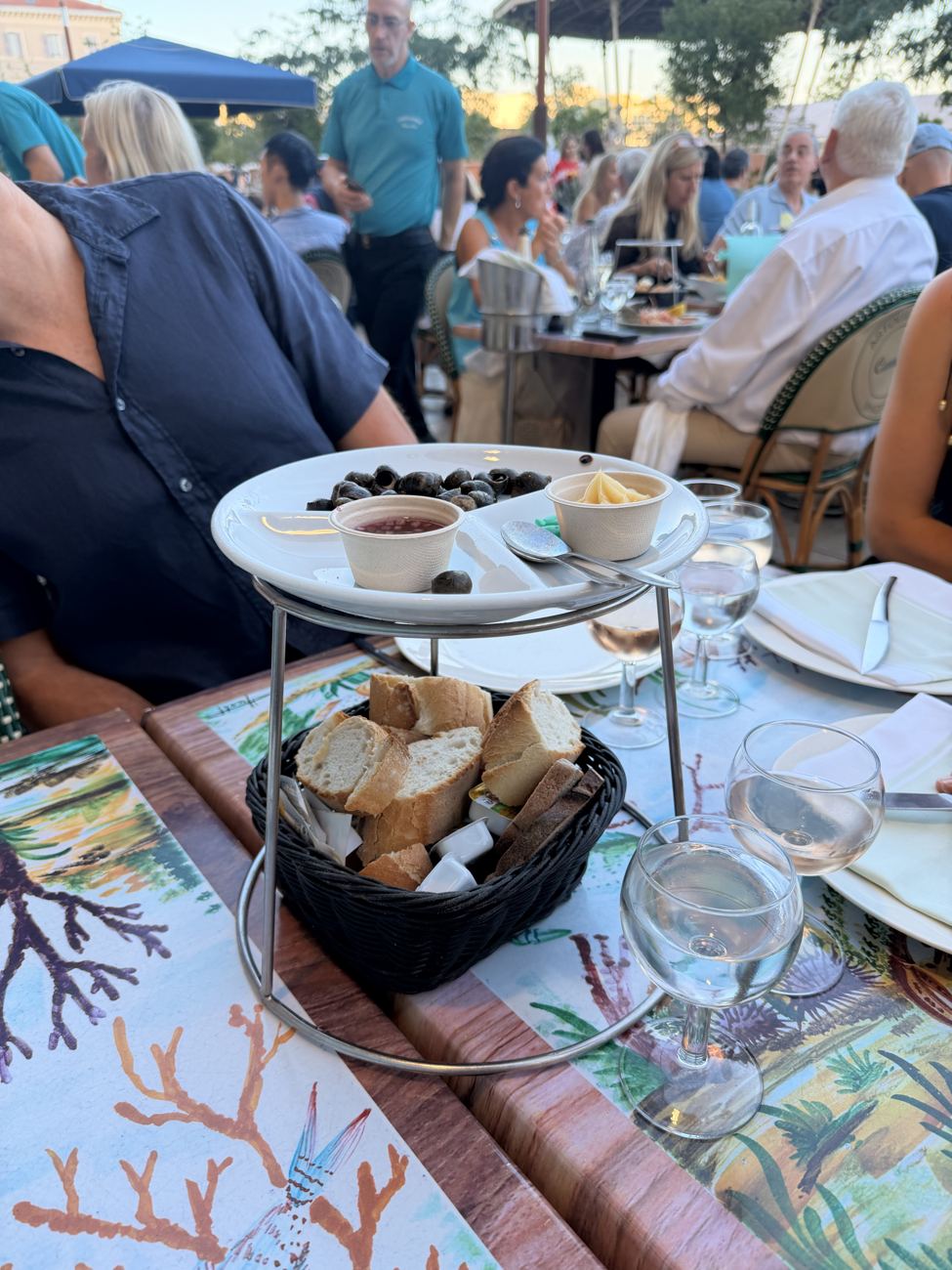 A plateau de fruits de mer — oysters and shellfish on ice on a tiled table