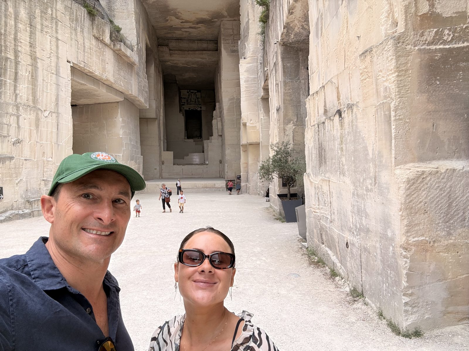 Two of the family in the blinding white quarry yard outside the Carrières