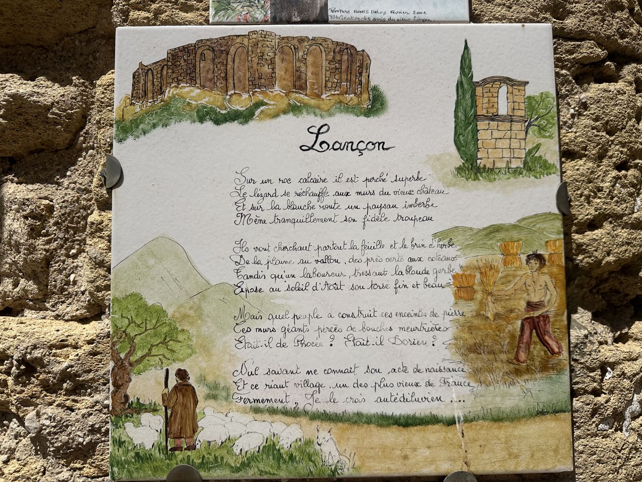 A hand-painted heritage panel titled Lançon, with a watercolour of the ruined château and a poem in cursive