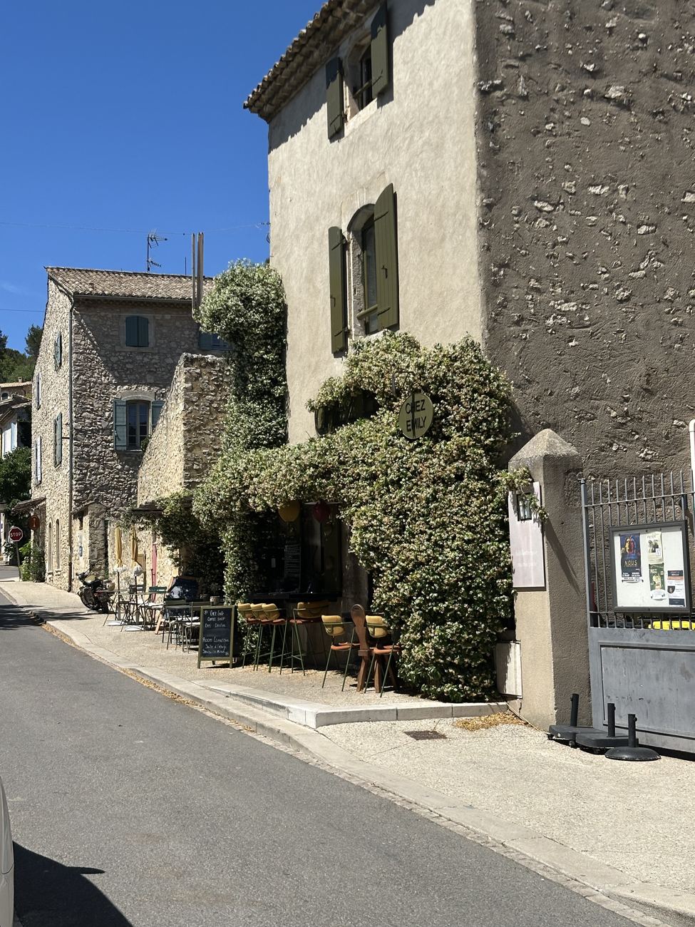 A narrow stone street climbing through the village of Lançon-de-Provence